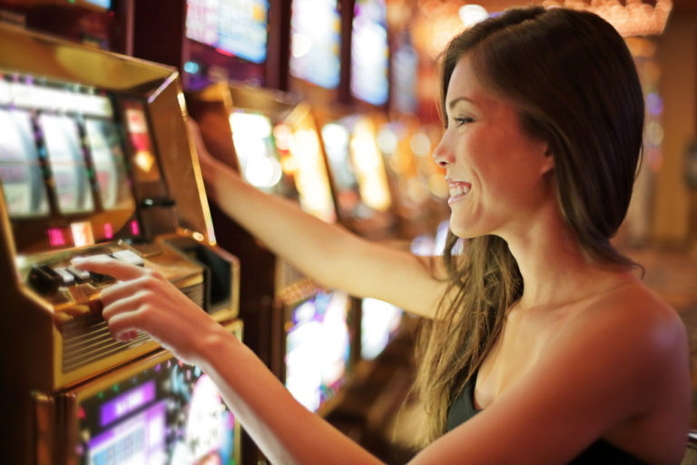 Asian,Woman,Gambling,In,Casino,Playing,On,Slot,Machines,Spending