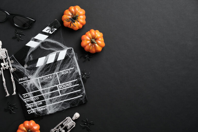 Movie,Clapperboard,And,Halloween,Decoration,On,Black,Table.,Horror,Movie